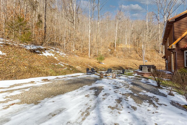 yard covered in snow with cooling unit