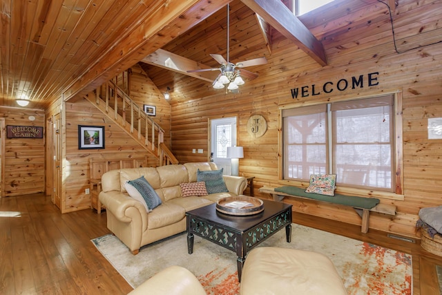 living room featuring wood ceiling, wooden walls, and hardwood / wood-style floors