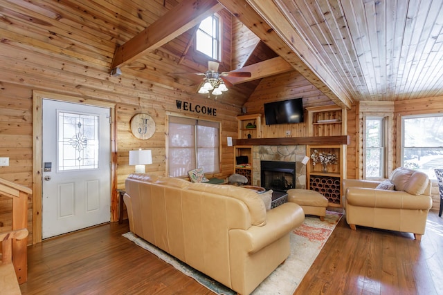 living room with hardwood / wood-style flooring, wooden walls, wooden ceiling, and lofted ceiling with beams