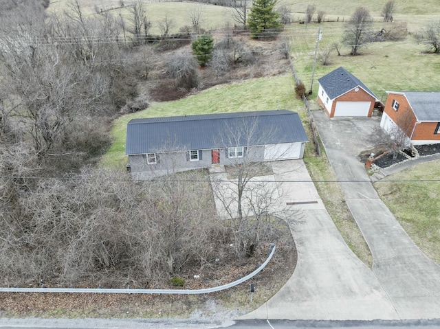 birds eye view of property with a rural view