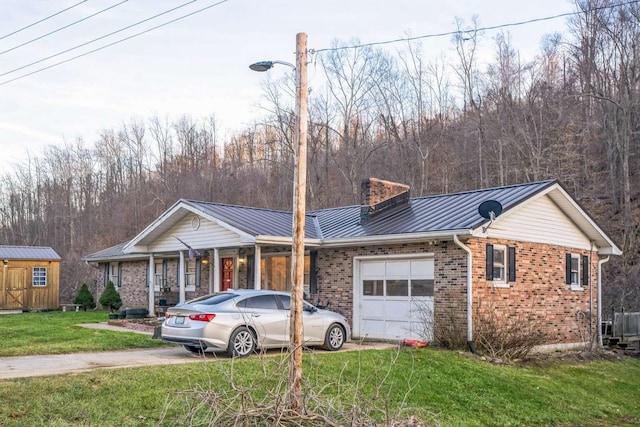 ranch-style house with a garage and a front lawn