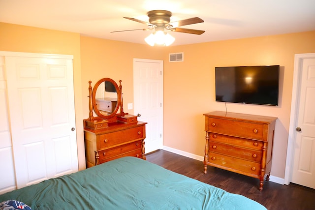 bedroom with ceiling fan and dark wood-type flooring