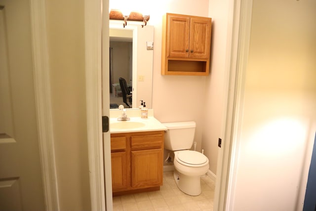 bathroom with toilet and vanity