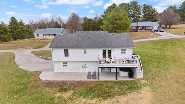 349 Sycamore Dr, Bronston, KY 42518 - rear view of property featuring a deck, a patio area, and a lawn