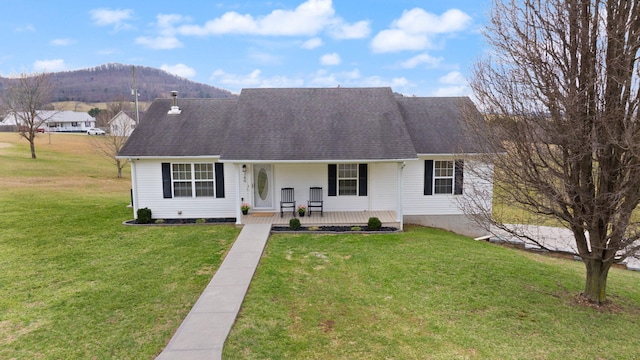 349 Sycamore Dr, Bronston, KY 42518 - view of front of home with a mountain view, a front yard, and covered porch