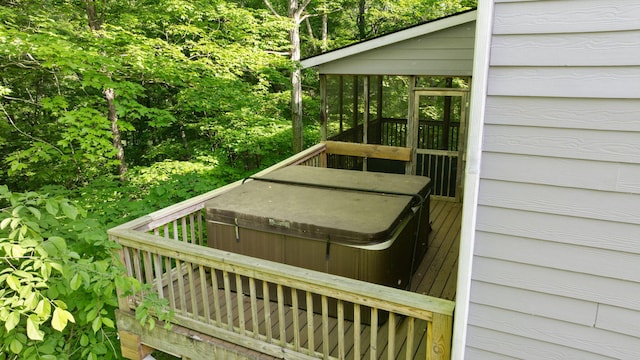 wooden terrace featuring a sunroom