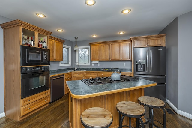 312 Avawam Dr, Richmond, KY 40475 - kitchen featuring black appliances, a sink, dark countertops, brown cabinets, and dark wood finished floors