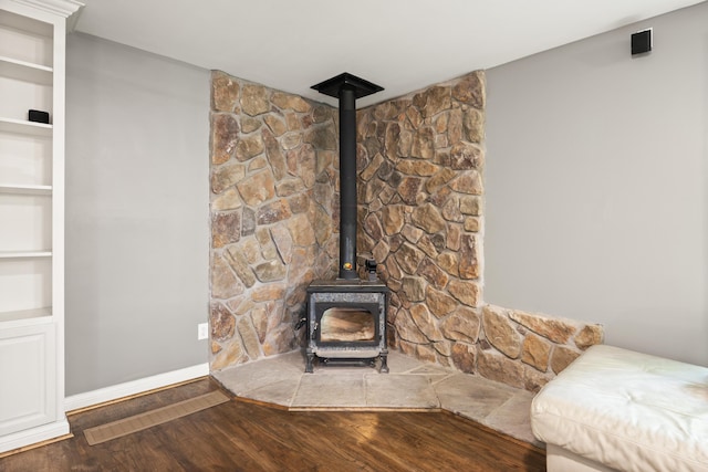 312 Avawam Dr, Richmond, KY 40475 - detailed view of a wood stove, wood finished floors, baseboards, and built in features