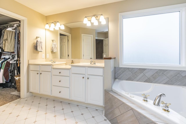 312 Avawam Dr, Richmond, KY 40475 - bathroom featuring double vanity, a garden tub, tile patterned floors, and a spacious closet