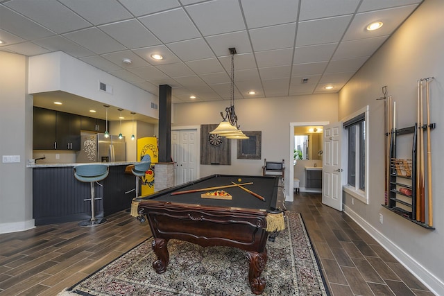 game room featuring wood finish floors, billiards, baseboards, and a drop ceiling