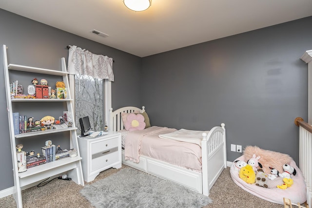 bedroom featuring carpet flooring and baseboards