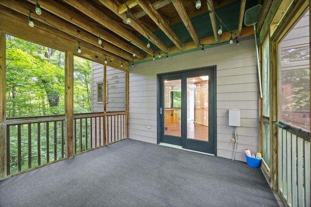 unfurnished sunroom featuring french doors