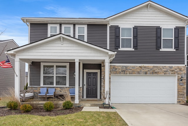 view of front of house with a garage and covered porch