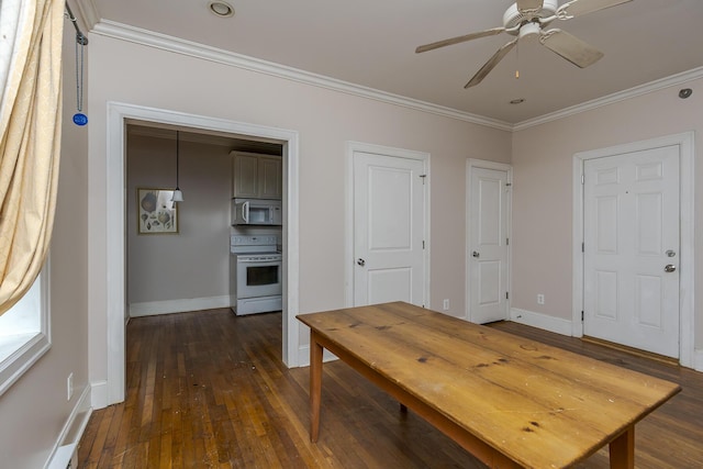 dining area featuring crown molding, dark wood-type flooring, and ceiling fan