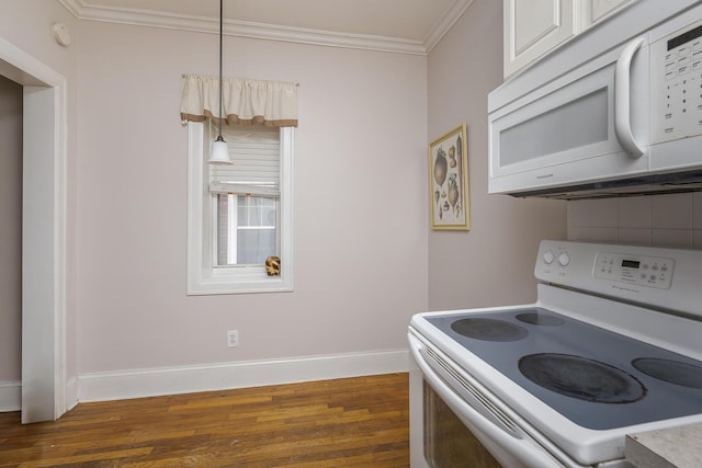 kitchen featuring dark wood-type flooring, crown molding, pendant lighting, white appliances, and decorative backsplash