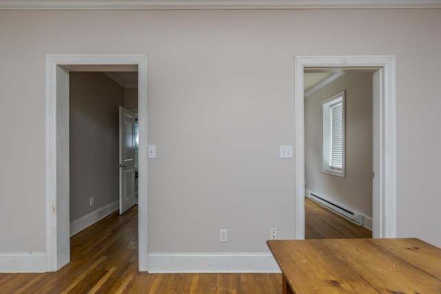 unfurnished room featuring a baseboard radiator, ornamental molding, and dark hardwood / wood-style flooring