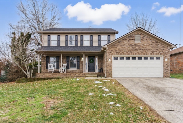 front of property featuring a garage, a front yard, and covered porch