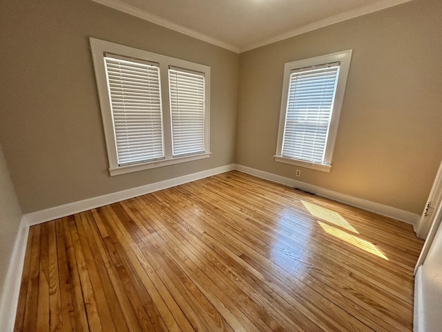 unfurnished room featuring crown molding and light hardwood / wood-style flooring