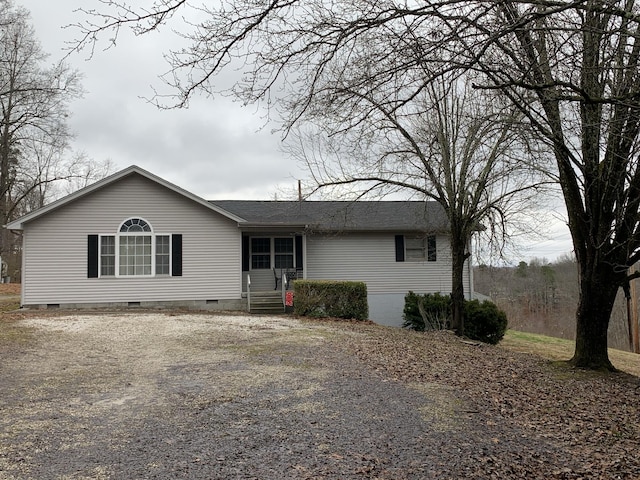 ranch-style home featuring crawl space and driveway