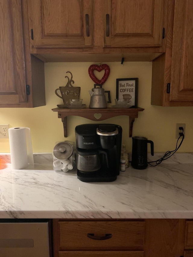 room details with brown cabinetry and light countertops