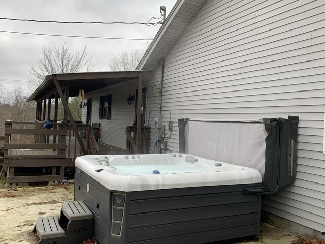 deck with a hot tub
