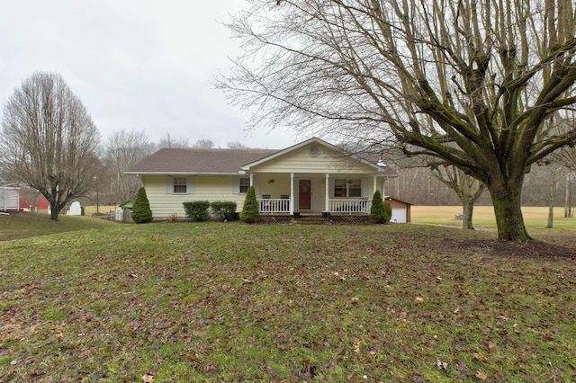 single story home with covered porch and a front lawn