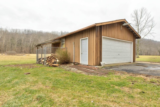 garage featuring a yard