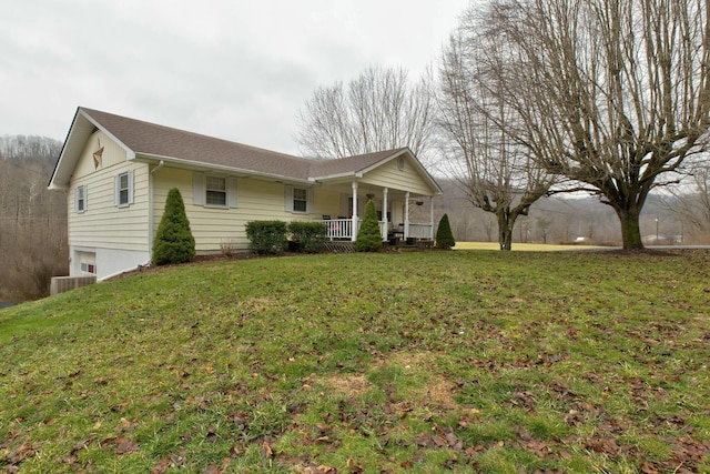 single story home with a front yard and covered porch