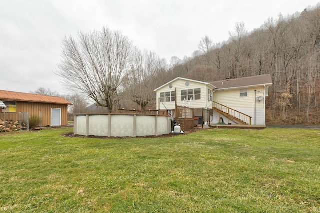 back of house featuring a yard