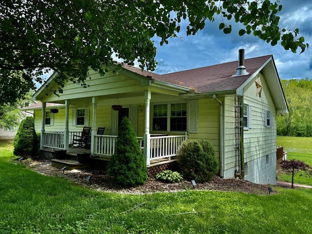 1695 Christy Creek Rd, Morehead, KY 40351 - view of front of property with covered porch, a front lawn, and roof with shingles