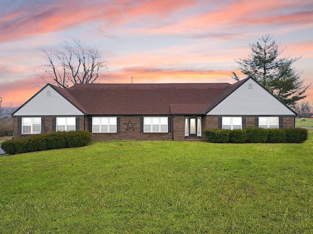 view of front of house with a yard