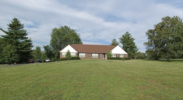 ranch-style house with a front lawn