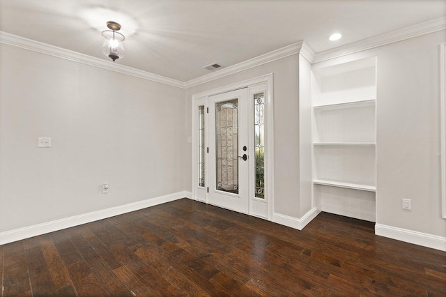 entrance foyer featuring dark wood-type flooring and ornamental molding