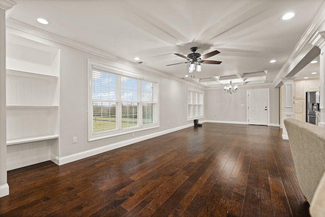 unfurnished living room featuring ornate columns, crown molding, dark wood-type flooring, and ceiling fan with notable chandelier