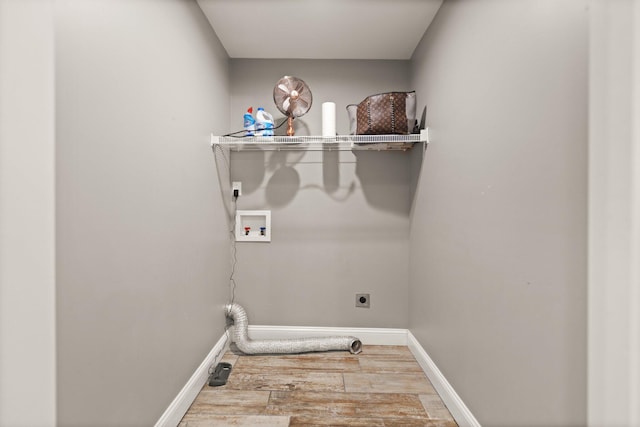 clothes washing area with wood-type flooring, hookup for a washing machine, and electric dryer hookup