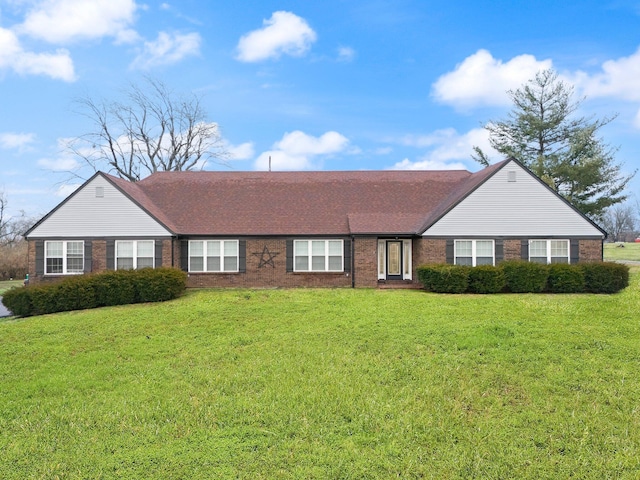 ranch-style home with a front lawn