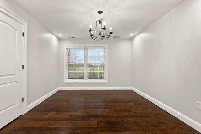 unfurnished dining area with an inviting chandelier and dark wood-type flooring