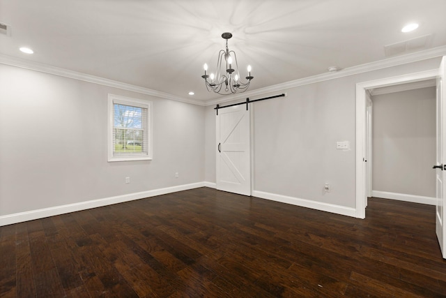 unfurnished bedroom with ornamental molding, a barn door, dark hardwood / wood-style floors, and an inviting chandelier