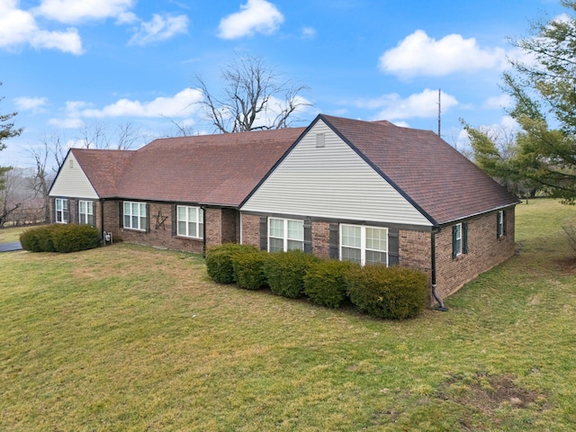 ranch-style house featuring a front lawn