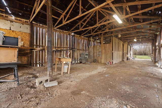 miscellaneous room with lofted ceiling