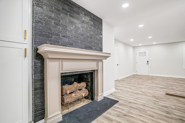 unfurnished living room featuring light hardwood / wood-style flooring