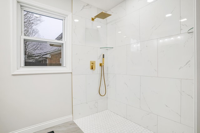 bathroom with a tile shower