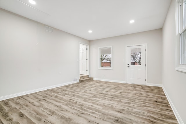 empty room with light wood-type flooring