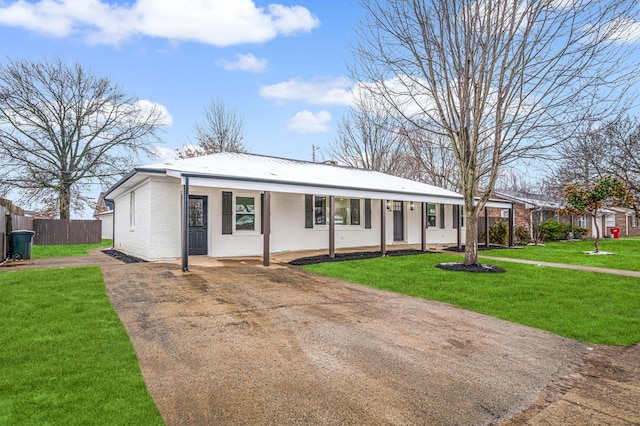 ranch-style home featuring a front yard