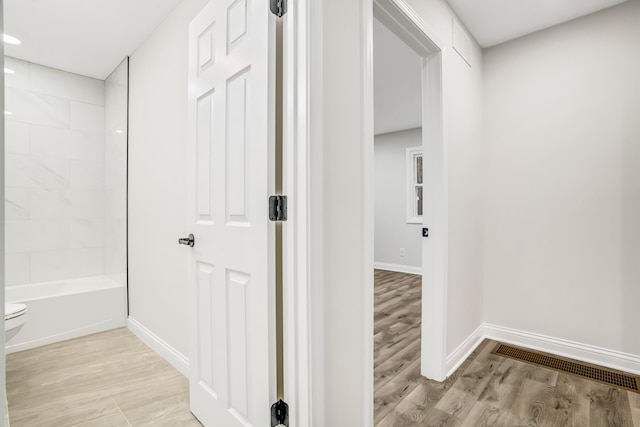 hall with light hardwood / wood-style flooring