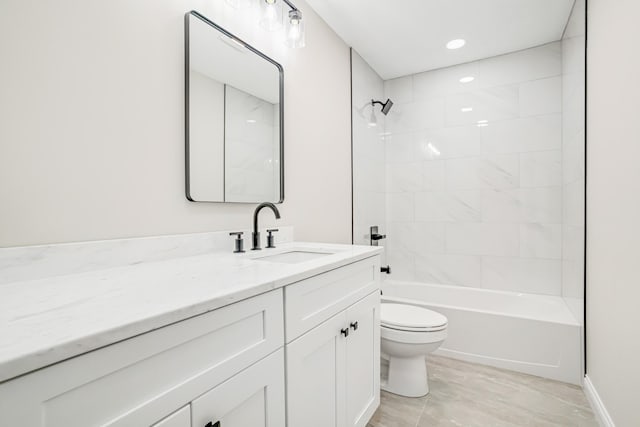 full bathroom featuring vanity, toilet, and tiled shower / bath combo