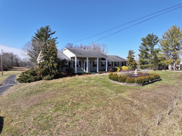 view of front facade with a porch and a front yard