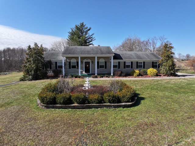 view of front of property with a porch and a front lawn