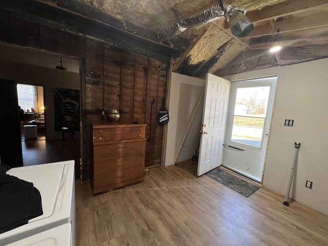 entryway with hardwood / wood-style flooring and lofted ceiling