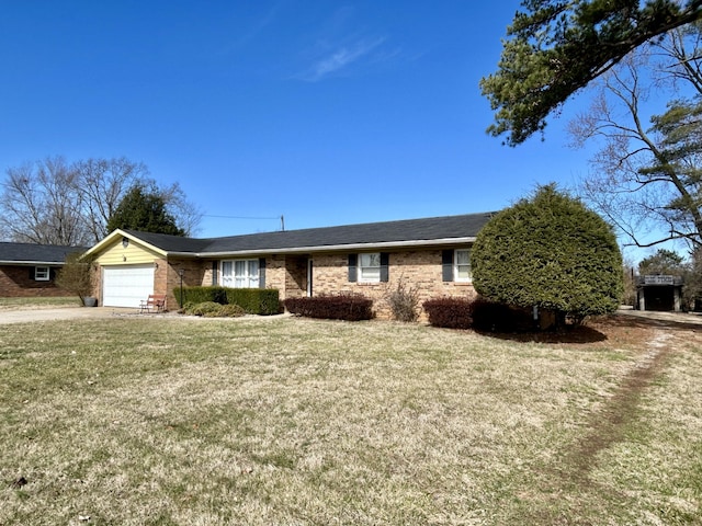 ranch-style home featuring a garage and a front yard